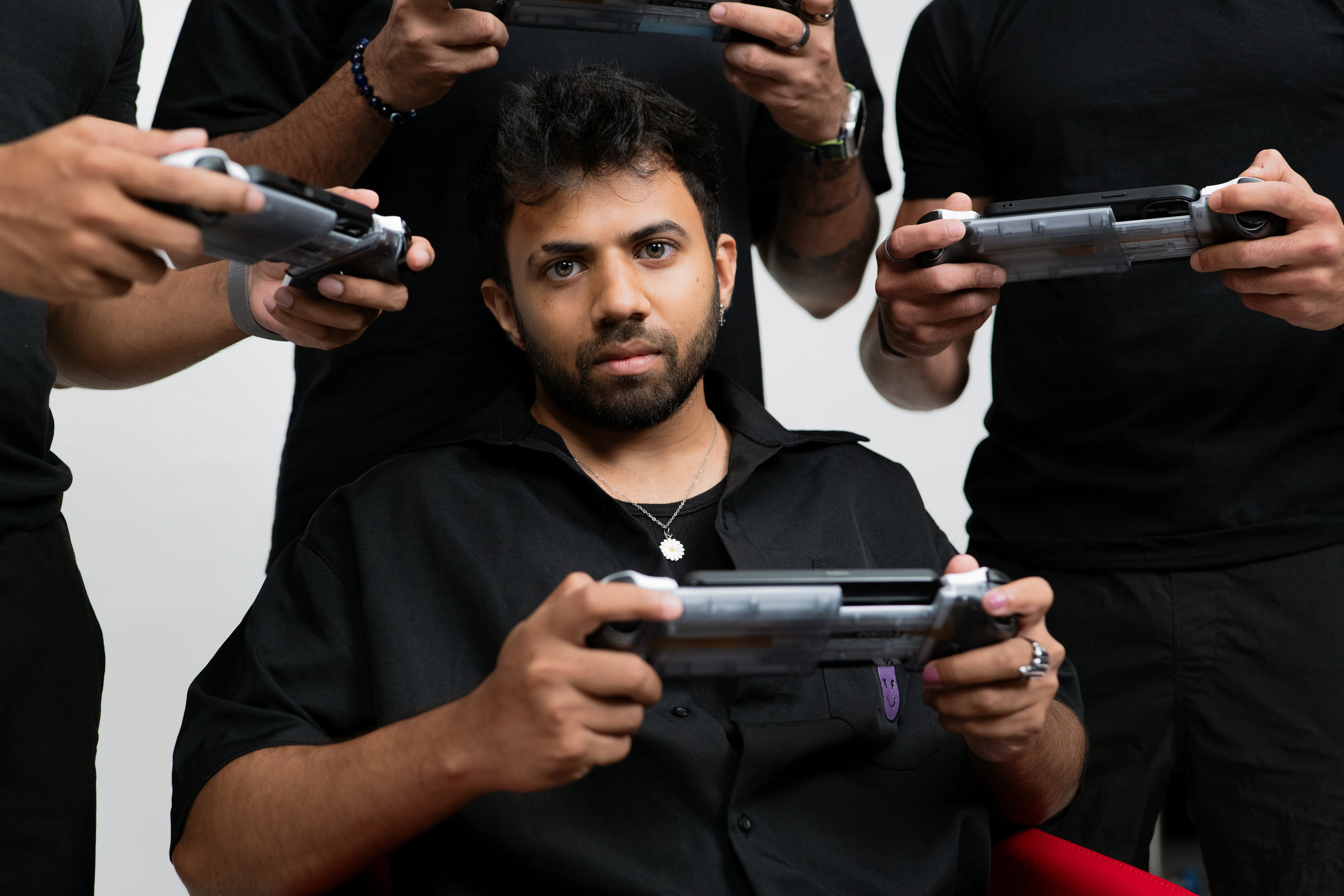 Gamers holding Headshot Pro controllers