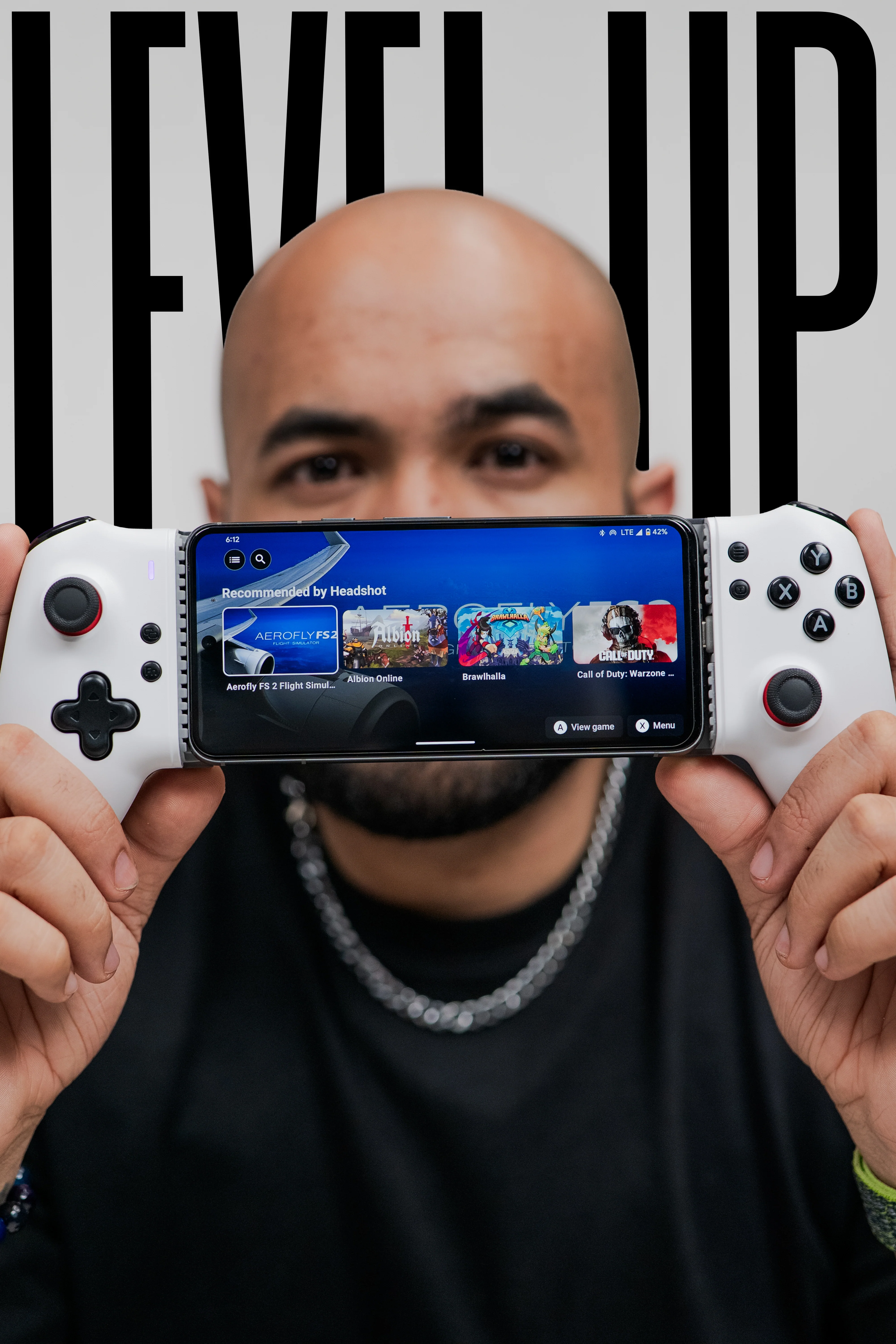 Level Up with Headshot Pro — gamer holding controller